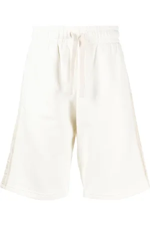 Palm Angels Pantalones cortos de chándal con franja del logo
