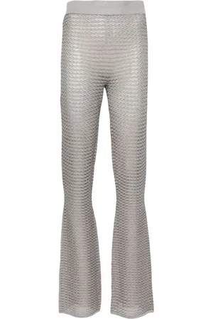 REMAIN Pantalones acampanados a rayas