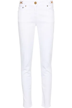 VERSACE Vaqueros skinny con placa Medusa