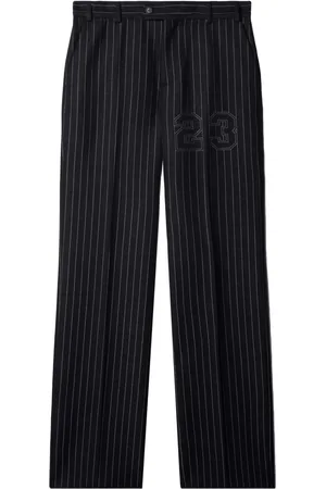 OFF-WHITE Pantalones slim a rayas diplomáticas