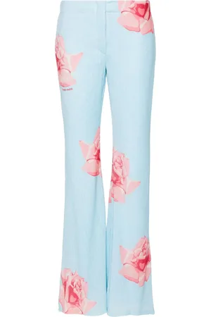 Kenzo Pantalones acampanados con rosa estampada