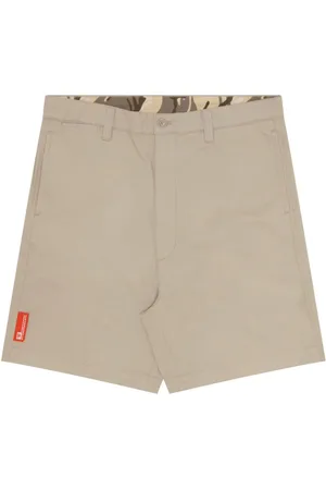 A Bathing Ape Bermudas chino con aplique del logo