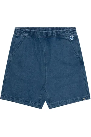 A Bathing Ape Pantalones vaqueros cortos con logo en relieve