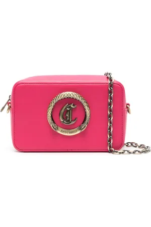 Roberto Cavalli Bolso con placa del logo