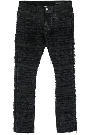 1017 ALYX 9SM Vaqueros skinny con efecto envejecido