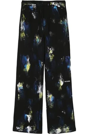 We11 Done Pantalones de chándal con estampado Painted