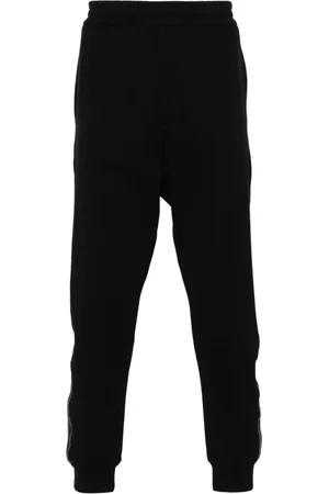 Alexander McQueen Pantalones de chándal con franjas del logo