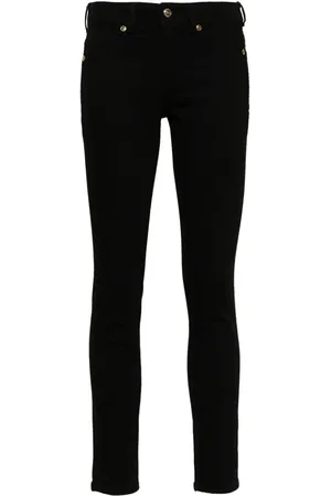 VERSACE Vaqueros skinny con placa del logo