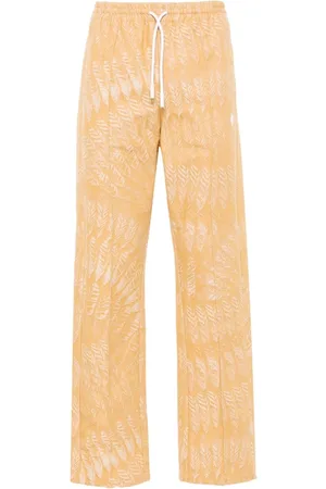 MARCELO BURLON Pantalones rectos AOP Feather