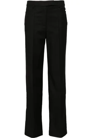 REMAIN Pantalones slim