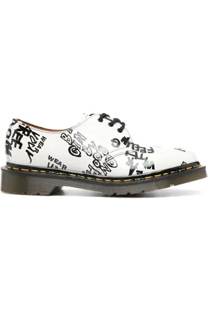 Comme des Garçons Zapatos derby con texto estampado de Comme des Garçons x Dr. Martens