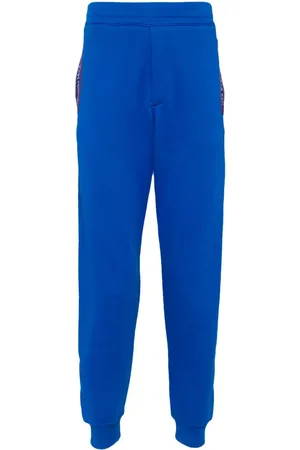 Alexander McQueen Pantalones de chándal con franjas del logo
