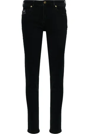 VERSACE Vaqueros skinny con placa del logo