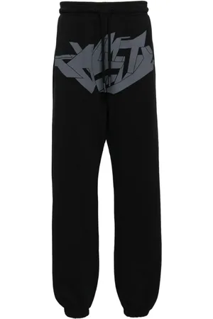 MARCELO BURLON Pantalones con estampado gráfico
