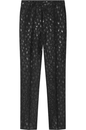 VERSACE Pantalones con estampado de leopardo