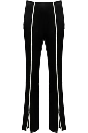 Nanushka Pantalones slim con ribete en contraste
