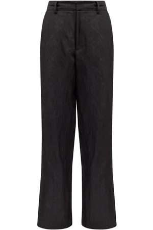 Maison Margiela Pantalones acampanados con costuras del logo