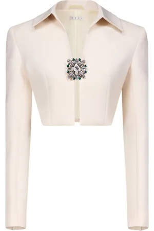 AREA Chaqueta corta con broche de cristal