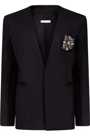 AREA Blazer sin cuello con broche de cristal