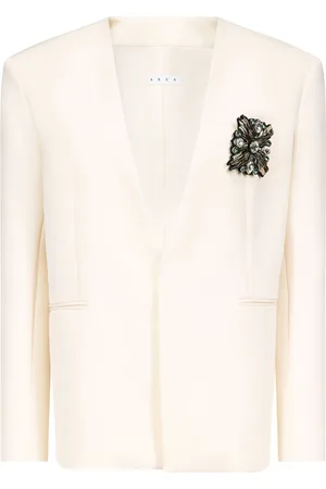 AREA Blazer sin cuello con broche de cristal