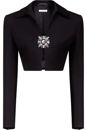 AREA Chaqueta corta con broche de cristal