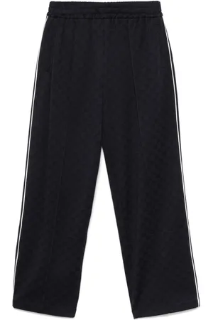 Gucci Pantalones de chándal con logo estampado
