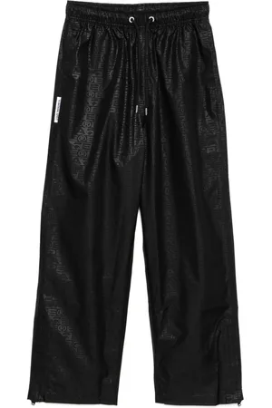 A Bathing Ape Pantalones con monograma estampado