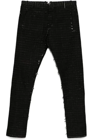 UNDER CONSTRUCTION Pantalones con efecto envejecido