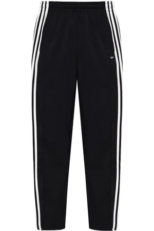 adidas Pantalones de chándal con rayas laterales