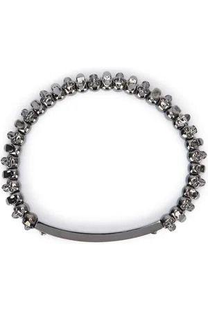 Alexander McQueen Pulsera con charm de calaveras