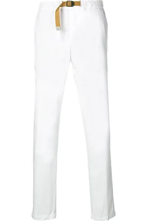 White Sand Pantalones slim con cinturón