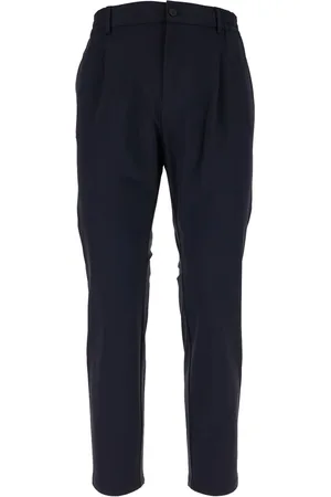 CRUNA Pantalones plisados