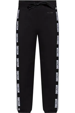 Moschino Pantalones holgados con franja del logo