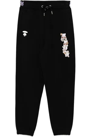 A Bathing Ape Pantalones Moonface con logo