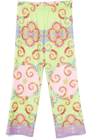 VERSACE Pantalones con estampado floral