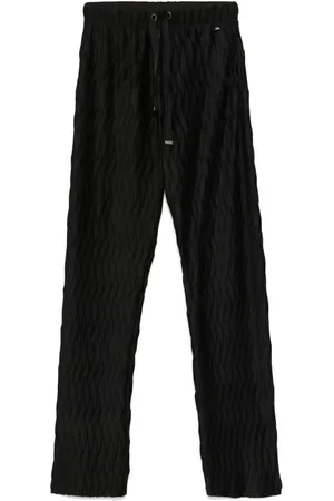 HERNO Pantalones ajustados con diseño plisado