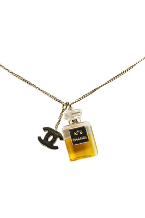 CHANEL Pendientes con colgante de perfume CC No.5 bañados en oro 2004
