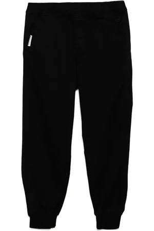 A Bathing Ape Pantalones ajustados con parche del logo