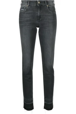 VERSACE Vaqueros skinny con parche del logo