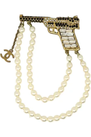 CHANEL Broche con motivo de pistola 2001