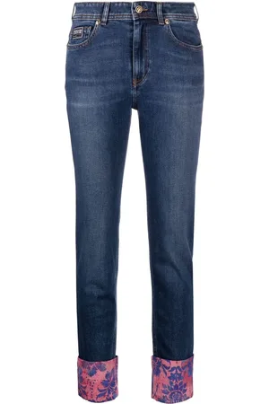 VERSACE Vaqueros skinny con puños barrocos