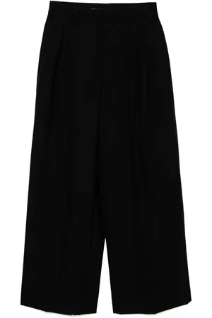 JUNYA WATANABE Pantalones anchos de lana con bolsillos