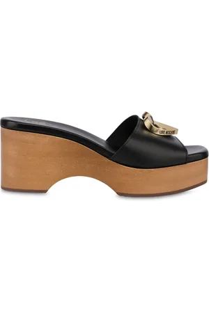 Moschino Mules con placa del logo