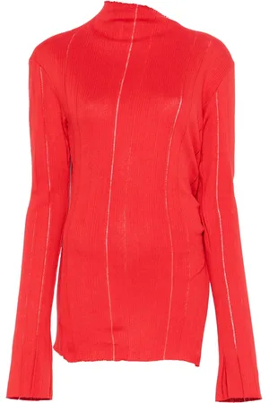 Jade Cropper Top de punto con detalle de abertura