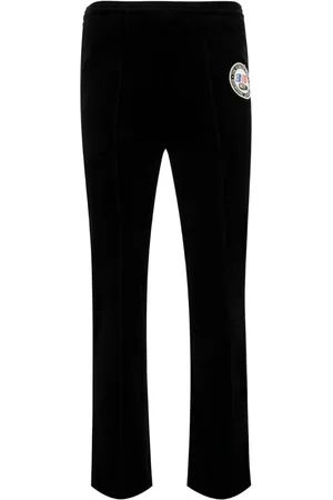 SAINT MXXXXXX Pantalones con parche del logo