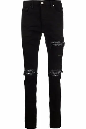 AMIRI Vaqueros skinny con detalles rasgados