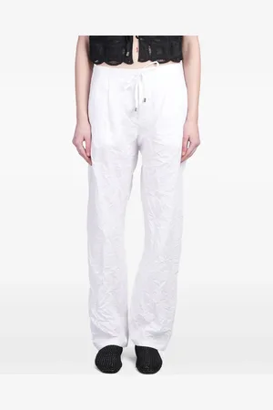 HOLY CAFTAN Pantalones con efecto arrugado