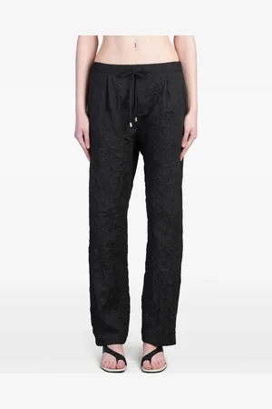 HOLY CAFTAN Pantalones con efecto arrugado