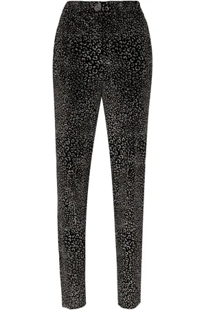GENNY Pantalones con estampado animalier