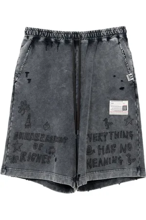 Maison Mihara Yasuhiro Pantalones vaqueros cortos con efecto lavado